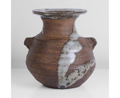 Stoneware, dry brown body with strong white splash front and back, the interior and short flared lip with white glaze, two lu