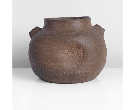 Stoneware, dry brown body with rough inclusions, a flash of transparent ash glaze, a roughly beaten and combed impression fro