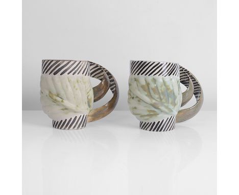 Earthenware, mottled cream and green glazes on a relief cabbage leaf body within two painted black and white bands, each with