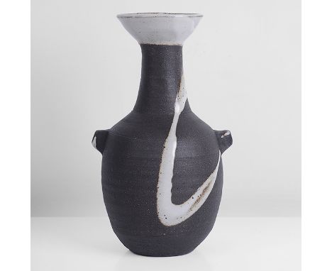 Stoneware, dry black body with strong white splashes front and back, the flared rim in white glaze with a soft iron speckle, 