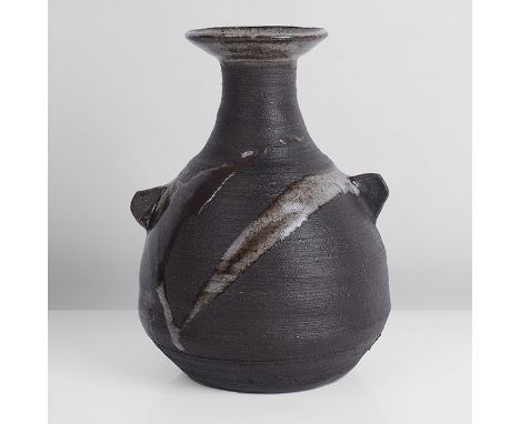 Stoneware, dry black body with mottled white and tenmoku splashes front and back, the interior and short flared lip with mott