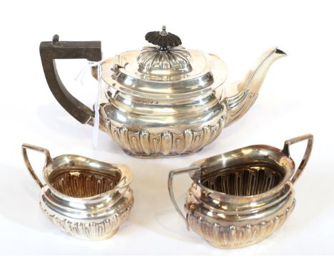 A Three-Piece Edward VII Silver Tea-Service, by William Aitken, Birmingham, 1902 and 1904, each piece fluted oval, the teapot