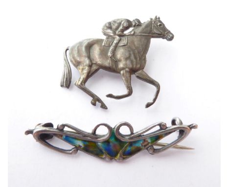 An Arts &amp; Crafts Enamel Silver Brooch; and A Horse and Jockey Brooch, stamped 'STERLING SILVER' (2) (a.f.) .  Gross weigh