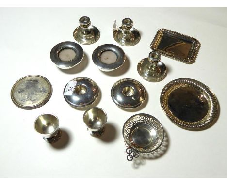 A Collection of Silver, including: a set of three silver and glass candlesticks; a pair of silver tea-light holders; a pair o