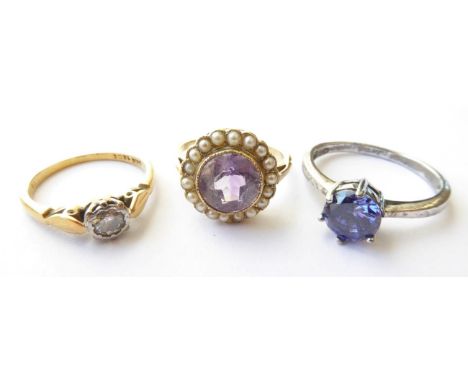 An Amethyst and Seed Pearl Ring, unmarked, finger size L1/2; A Diamond Solitaire Ring, stamped '18CT', finger size K; and A G