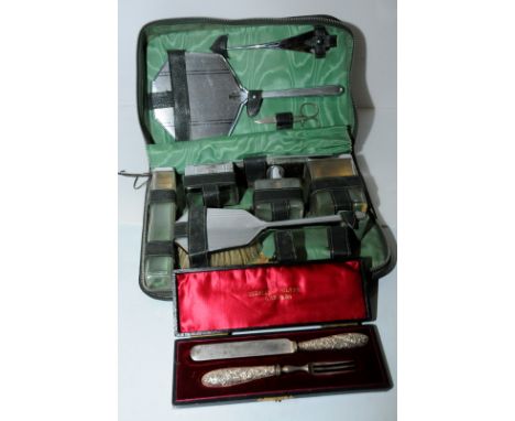 Cased silver handled knife and fork set and cased retro manicure set