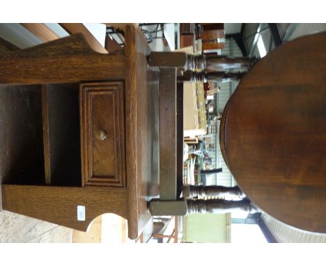 Small oak drop leaf table and an oak occasional table with single drawer, shelf base and magazine side racks 