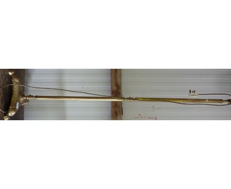 Brass standard lamp with lion paw feet
