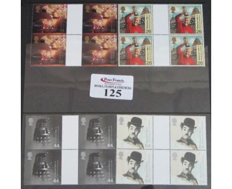 Great Britain range of 1999 millennium issues in green Hagner Binder. Stamps are in gutter blocks of 4, cylinder and traffic 