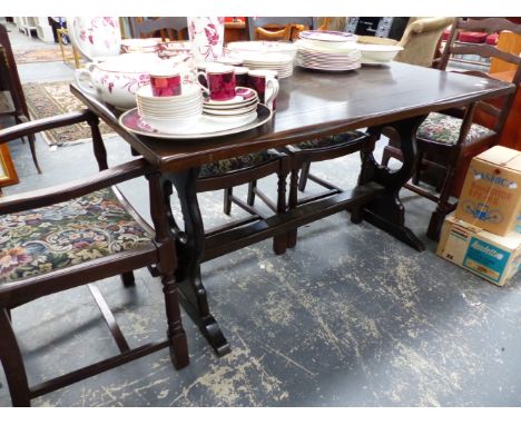 A SMALL OAK REFECTORY STYLE TABLE AND SIX LADDER BACK CHAIRS.