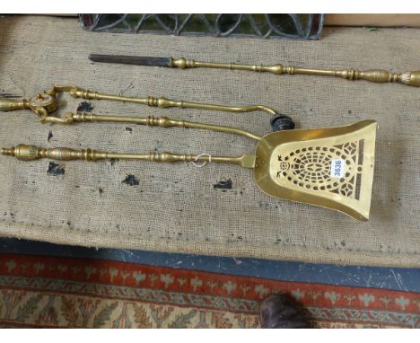 A SET OF GOOD VICTORIAN BRASS FIRESIDE TOOLS AND MATCHING DOGS.