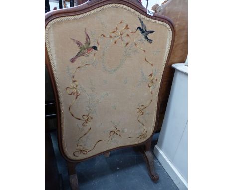 A MAHOGANY SHOW FRAME EMBROIDERED FIRESCREEN.