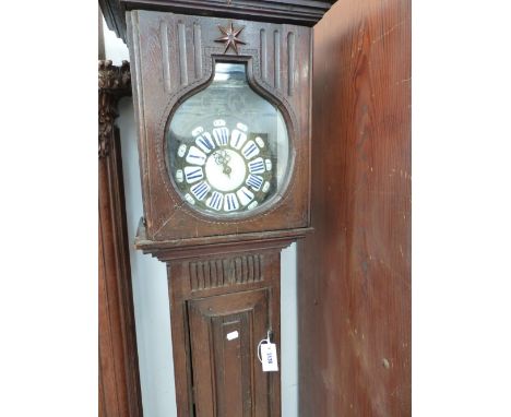 A FRENCH OAK CLOCK CASE AND ASSOCIATED ENAMEL AND BRASS DIAL MOVEMENT.