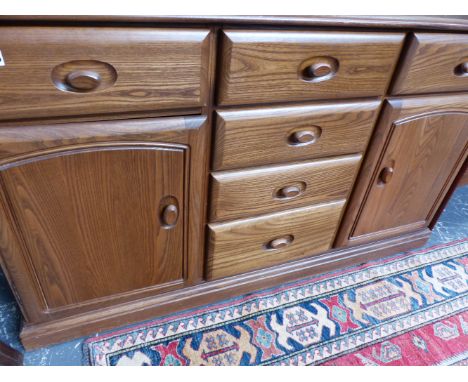 AN ERCOL STYLE ELM SIDEBOARD.