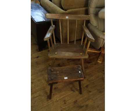 Antique painted stick back broad seated armchair and stool.