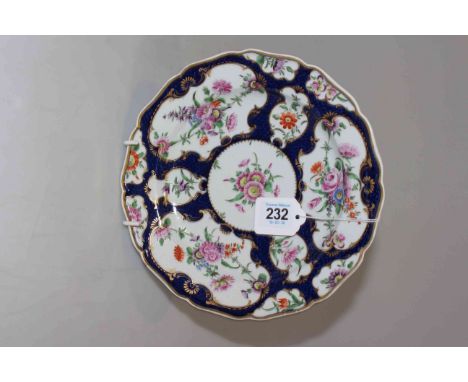 Antique porcelain plate with Worcester blue square fret mark, painted with flowers in shaped panels with gilt borders and blu