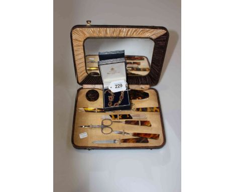 9 carat gold and ruby fancy link bracelet, together with cased faux tortoiseshell handled manicure set (2).