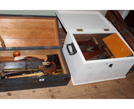 Two boxes of joinery tools including planes, saw, levels, rules, etc.