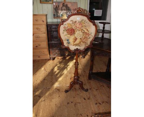 Victorian mahogany tripod screen with floral needlework panel.