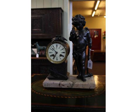 Victorian mantel clock, having winged cherub beside pedestal clock on marble base, 37cm.
