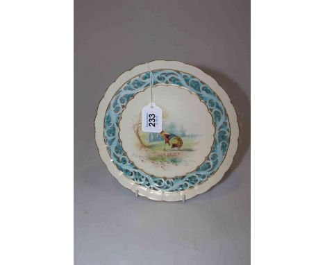 Locke &amp; Co. Worcester plate painted with peacock in landscape within pierced scroll border, 22cm diameter.