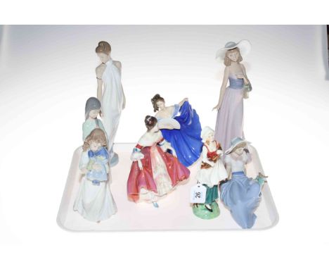 Five Nao figures and three Royal Doulton figures.