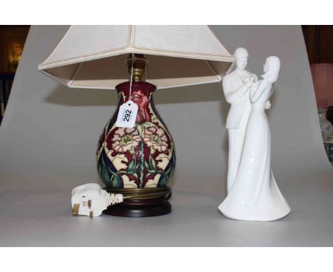 Moorcroft Pottery table lamp, the baluster body with three panels of stylised flower decoration, 23cm, with shade, together w