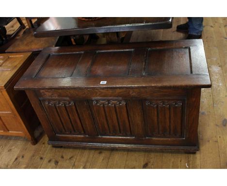Oak triple linen fold panel front blanket box, 58cm by 107.5cm.