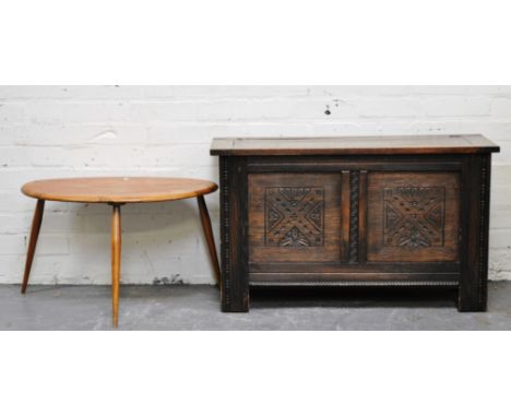 Oak blanket box, hinged lid, carved panels, width 91cm and an Ercol coffee table, (2).