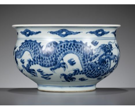 A BLUE AND WHITE 'DRAGON' BOMBE CENSER, TRANSITIONAL TO EARLY KANGXI PERIODChina, c. 1630-1680. Boldly painted to the exterio