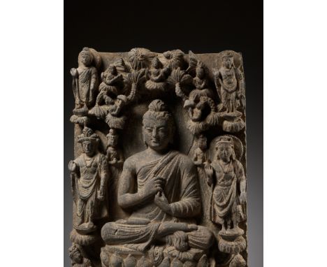 A SCHIST STELE DEPICTING BUDDHA, ANCIENT REGION OF GANDHARA, 3RD-4TH CENTURYOf rectangular form, deeply carved in high relief