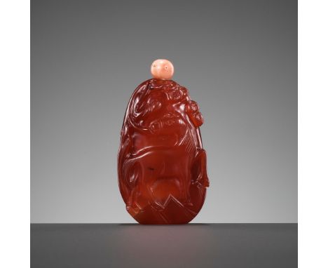 A 'DEER AND HORSE' CARNELIAN SNUFF BOTTLE, QING DYNASTYChina, 19th century. Well carved from a pebble in high relief to depic