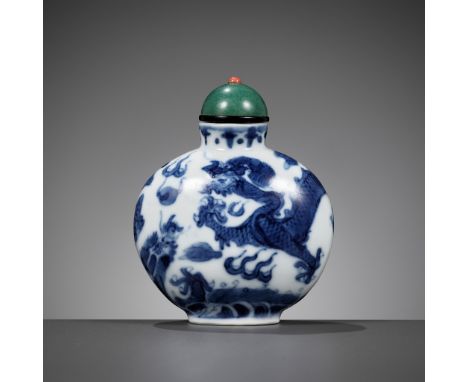 A BLUE AND WHITE 'DRAGON' SNUFF BOTTLE, MID-QING DYNASTYChina, 1750-1850. Of flattened globular form, supported on a short ov