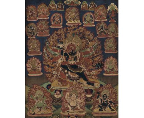 A THANKGA OF GURU DRAGPO WITH HIS CONSORT, TIBET, 18TH CENTURYDistemper and gold on cloth. The wrathful deity striding in ali