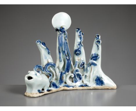 A BLUE AND WHITE 'MOUNTAIN' BRUSHREST WITH AN INTEGRAL 'XINIU' WATERDROPPER, QING DYNASTYExpert's note: This ingenious piece 