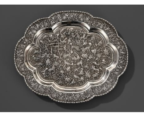 A LARGE SILVER REPOUSSE 'BUDDHIST LION' TRAY, LATE QING DYNASTYExpert's note: The incision work is remarkably fine on this ex
