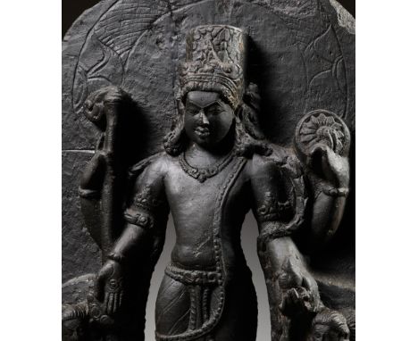 A GRAY SCHIST STELE OF VISHNU, NORTHEASTERN INDIA, PALA PERIOD, 11TH - 12TH CENTURYFinely carved as Vishnu standing in samabh