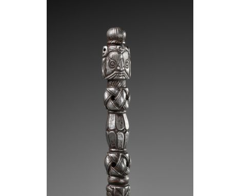 A COPPER-INLAID IRON PHURBHA, TIBET, 15TH-16TH CENTURYThe tripartite blade issuing from the fangs of a makara and with snakes