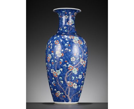 A DOUCAI 'CRACKED ICE AND PRUNUS' BALUSTER VASE, LATE QING DYNASTYChina, 19th century. The ovoid body tapering towards the fo