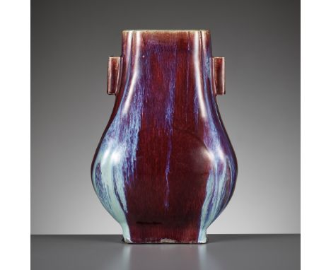 A FLAMBE GLAZED VASE, FANGHU, XUANTONG MARK AND PERIODChina, 1908-1911. Of archaic bronze form, the pear-shaped body of squar