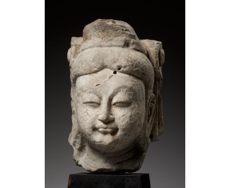 A WHITE MARBLE HEAD OF A BODHISATTVA, NORTHERN QI DYNASTYOpinion: Northern Qi sculptures of this size are exceedingly rare, a