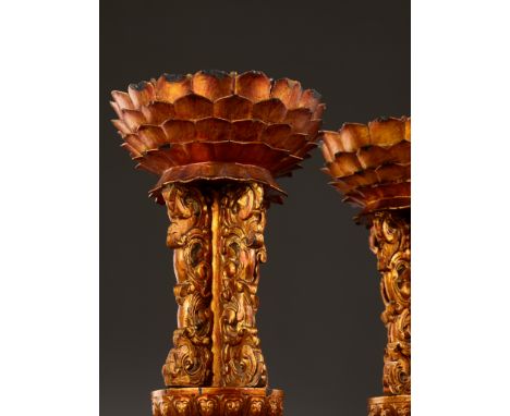 A PAIR OF GILT-LACQUERED WOOD ALTAR EMBLEM STANDS, QING DYNASTYChina, 18th-19th century. Each supported on a domed lotus-peta