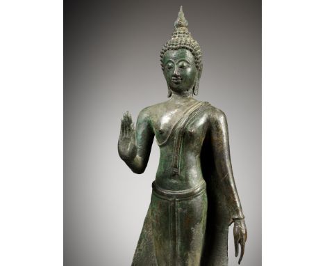 A THAI BRONZE FIGURE OF BUDDHA, AYUTTHAYA KINGDOMThailand, 17th century. Cast standing in samabhanga, the right hand raised i