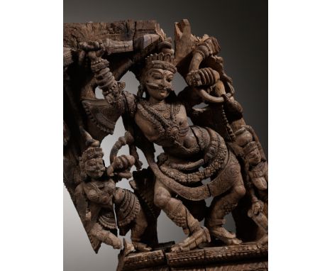 A WOOD RELIEF OF A DANCING DEITY, KERALA, SOUTH INDIA, 18TH TO EARLY 19TH CENTURYRichly carved and reticulated with a dancing