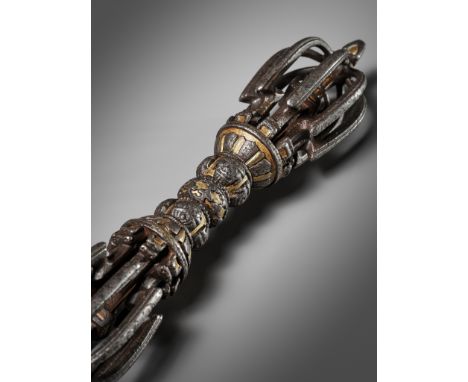 A LARGE PARCEL-GILT IRON VAJRA, TIBET, 12TH - 13TH CENTURYThe eight-pronged vajra with a central knob of compressed globular 