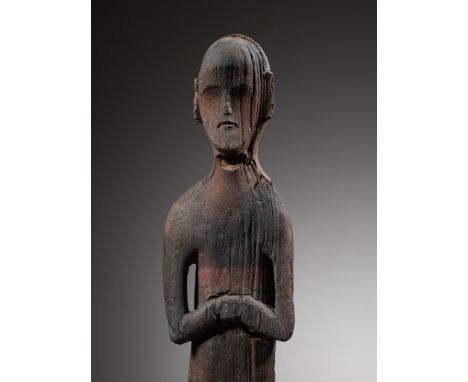 A RARE PAINTED WOOD FIGURE OF A 'BEAUTY', EASTERN ZHOU DYNASTYChina, 4th century BC. Elegantly yet plainly carved, the large 