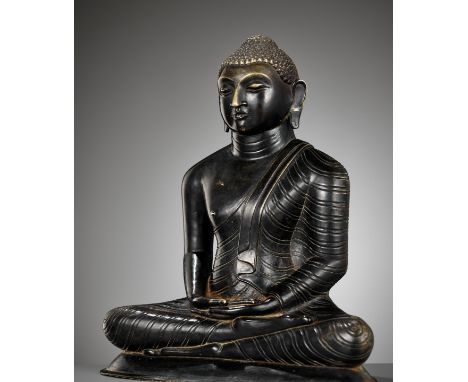 A BRONZE FIGURE OF BUDDHA, SRI LANKA, 18TH TO 19TH CENTURYHeavily cast, seated in dhyanasana atop a low spreading base, the h