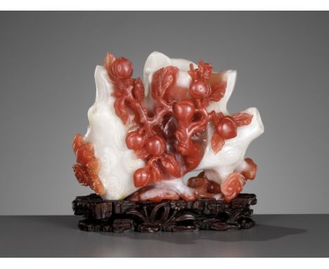 A CARNELIAN AGATE 'PEACH AND LINGZHI' RETICULATED DOUBLE VASE, 18TH CENTURYChina. The vessel with two receptacles carved as g