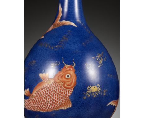 A POWDER-BLUE GROUND 'THREE CARP' BOTTLE VASE, KANGXI PERIODChina, 1662-1722. The globular body rising from a short foot to a