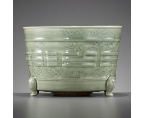 A LARGE LONGQUAN 'TRIGRAM' TRIPOD CENSER, YUAN TO MING DYNASTYChina, 13th to 15th century. Heavily potted, the deep flaring s